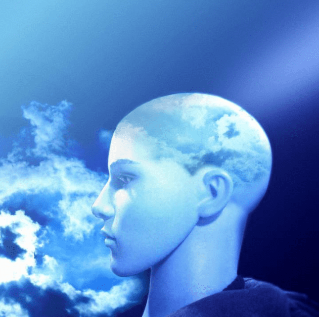 Surreal blue human head blending with sky and clouds.