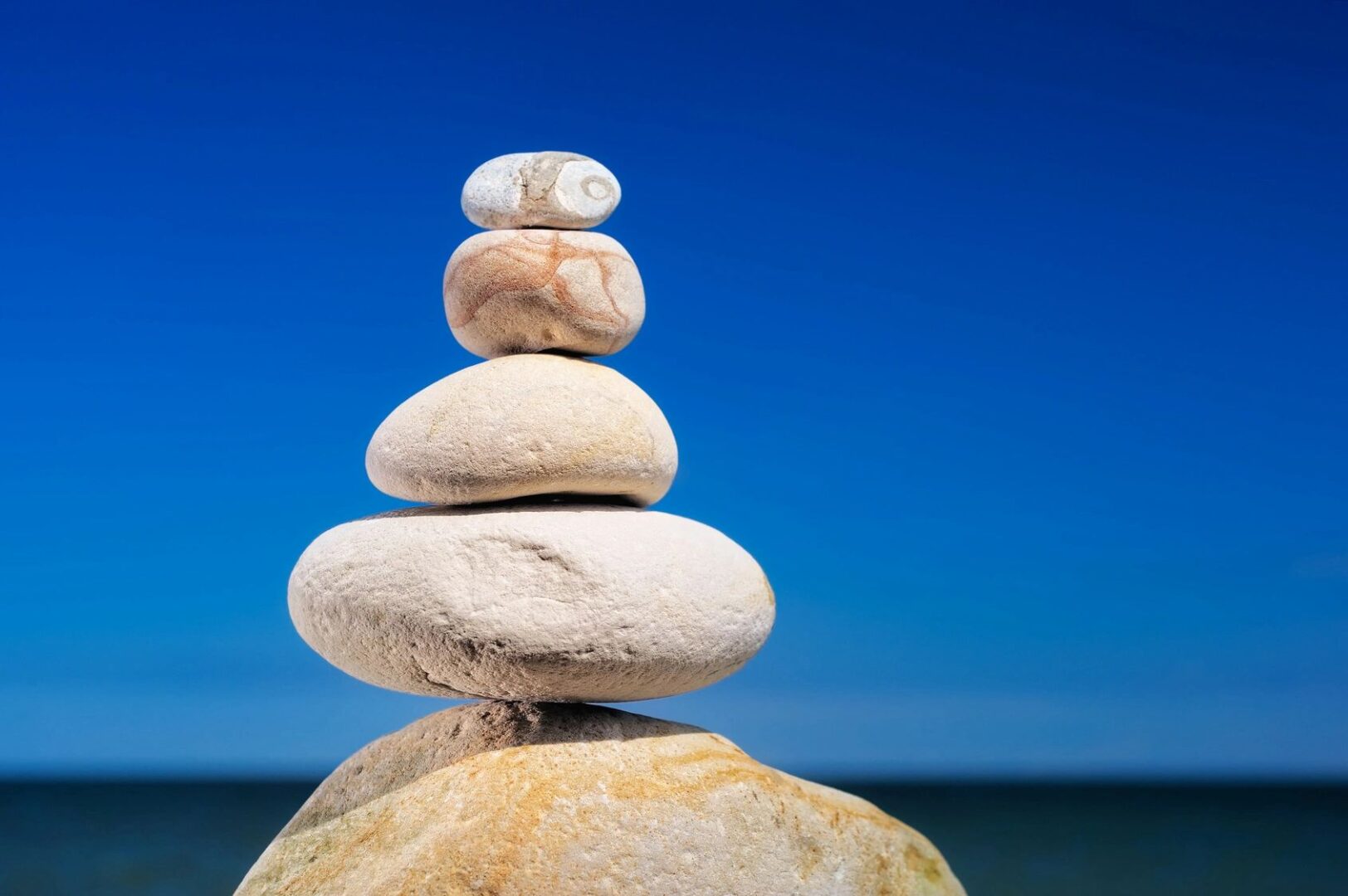 Scott Lingen, Psy.D. A stack of rocks on top of each other.